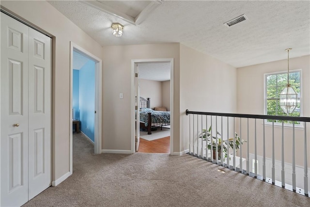 5109 Forest Ridge Dr, South Fayette, PA 15057 - hallway featuring carpet floors, a textured ceiling, and baseboards