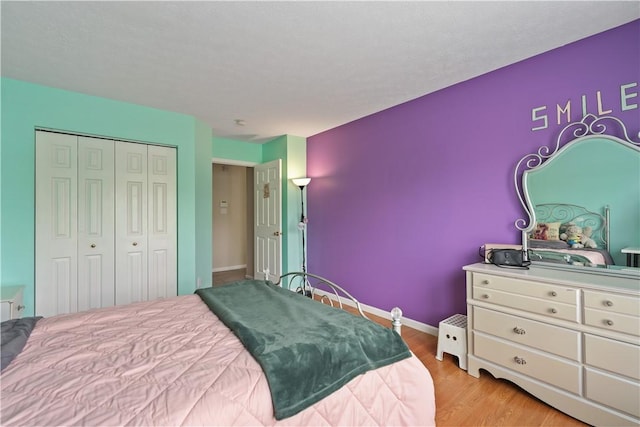 5109 Forest Ridge Dr, South Fayette, PA 15057 - bedroom featuring light wood-style floors, a closet, and baseboards