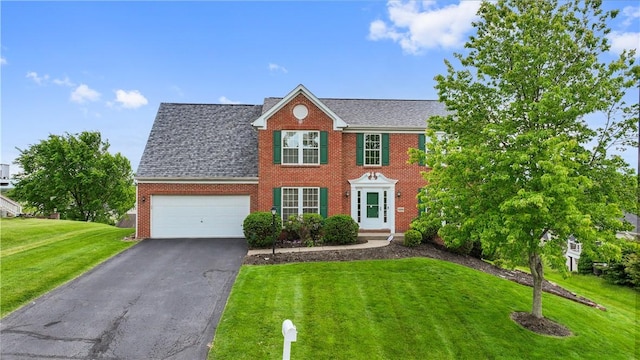 5109 Forest Ridge Dr, South Fayette, PA 15057 - colonial house with brick siding, a front yard, a garage, driveway, and roof with shingles