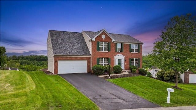 5109 Forest Ridge Dr, South Fayette, PA 15057 - colonial home with brick siding, a garage, asphalt driveway, and a front yard