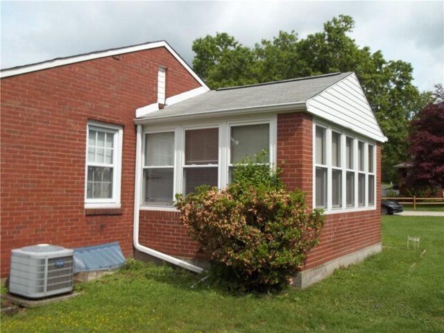 109 Mason Dr, Shaler, PA 15116 - view of side of property with central AC unit, brick siding, and a yard