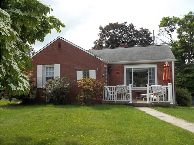 109 Mason Dr, Shaler, PA 15116 - rear view of house with brick siding, a yard, a chimney, and a porch