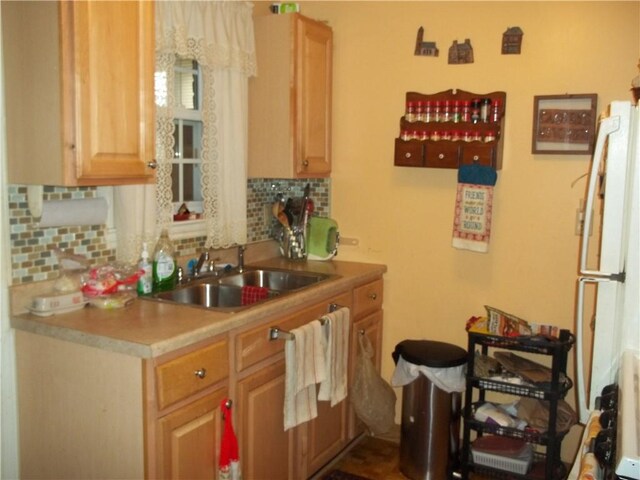 109 Mason Dr, Shaler, PA 15116 - kitchen featuring freestanding refrigerator, decorative backsplash, a sink, and light countertops