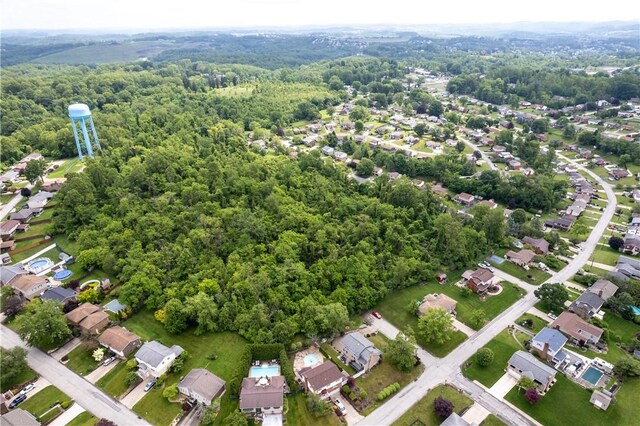 200 Sunrise Dr, Penn Twp Wml, PA 15642 - aerial view of residential area with a heavily wooded area
