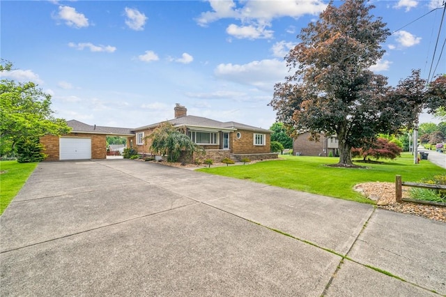 621 Kimlyn Ave, North Huntingdon, PA 15642 - ranch-style home featuring concrete driveway, a front yard, an attached garage, and a chimney