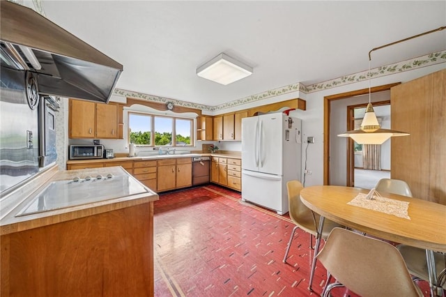 621 Kimlyn Ave, North Huntingdon, PA 15642 - kitchen featuring stainless steel appliances, exhaust hood, light countertops, pendant lighting, and a sink