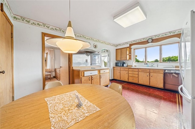 621 Kimlyn Ave, North Huntingdon, PA 15642 - kitchen featuring dishwashing machine, stainless steel microwave, light countertops, freestanding refrigerator, and a sink