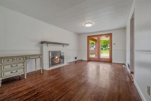 200 Spartan Dr, Bethel Park, PA 15102 - unfurnished living room featuring wood finished floors and a brick fireplace