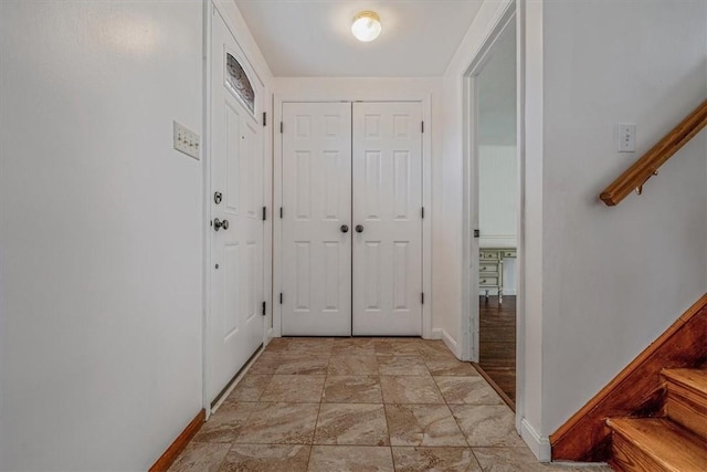 200 Spartan Dr, Bethel Park, PA 15102 - entryway with baseboards, stairway, and light stone finish floors