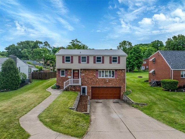 200 Spartan Dr, Bethel Park, PA 15102 - view of front of property featuring brick siding, driveway, and a garage
