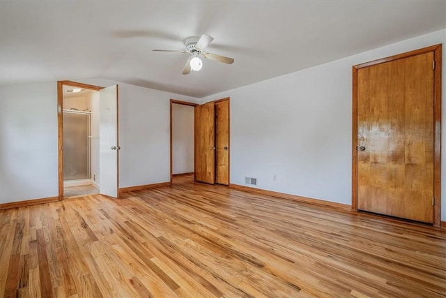 200 Spartan Dr, Bethel Park, PA 15102 - unfurnished bedroom with light wood-style flooring, baseboards, connected bathroom, ceiling fan, and lofted ceiling