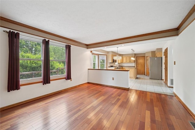 5020 Meadow Crest Dr, Hampton, PA 15101 - unfurnished living room featuring light wood-style floors, baseboards, and crown molding