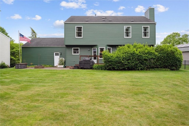 5020 Meadow Crest Dr, Hampton, PA 15101 - back of house featuring a lawn, a chimney, a deck, and roof with shingles