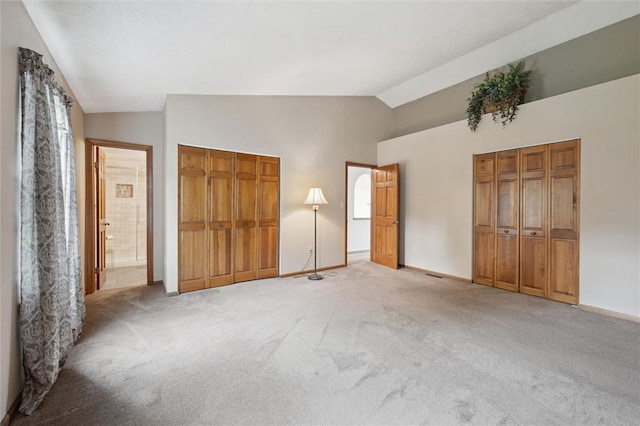 5020 Meadow Crest Dr, Hampton, PA 15101 - unfurnished bedroom with lofted ceiling, light carpet, baseboards, and ensuite bathroom