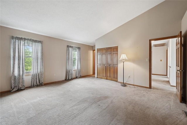 5020 Meadow Crest Dr, Hampton, PA 15101 - unfurnished bedroom featuring multiple windows, light carpet, baseboards, and vaulted ceiling