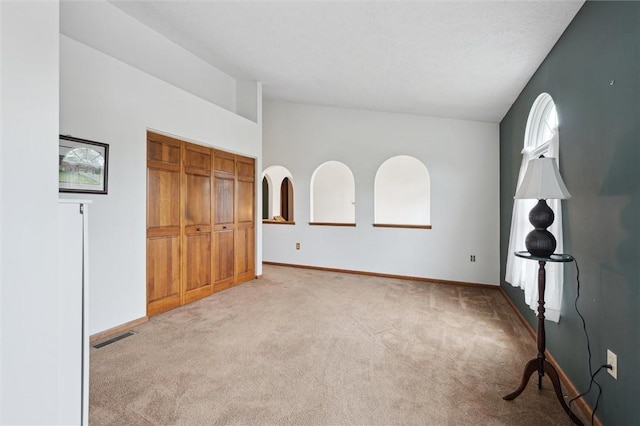 5020 Meadow Crest Dr, Hampton, PA 15101 - unfurnished bedroom with carpet floors, vaulted ceiling, baseboards, and a closet