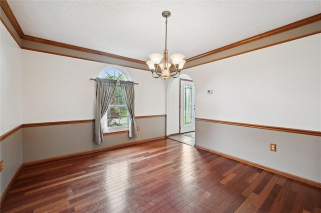 5020 Meadow Crest Dr, Hampton, PA 15101 - empty room with hardwood / wood-style flooring, arched walkways, a chandelier, crown molding, and baseboards