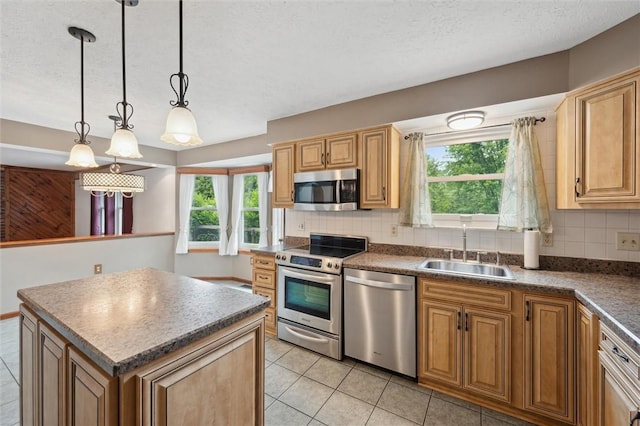 5020 Meadow Crest Dr, Hampton, PA 15101 - kitchen featuring stainless steel appliances, a sink, decorative backsplash, plenty of natural light, and a textured ceiling