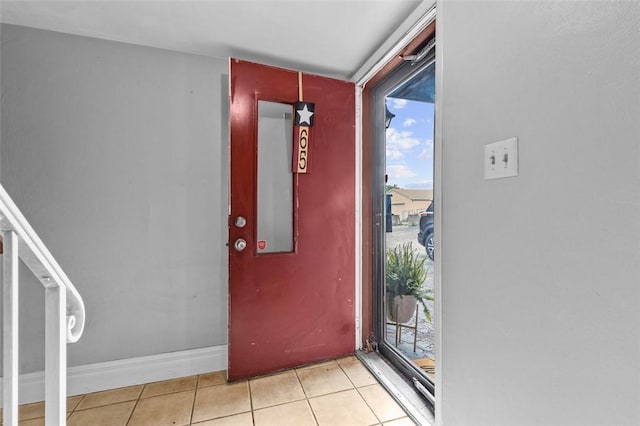 65 Universal St, Bridgeville, PA 15017 - entryway with light tile patterned flooring, healthy amount of natural light, and baseboards