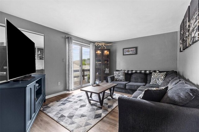 65 Universal St, Bridgeville, PA 15017 - living room featuring light wood-style floors