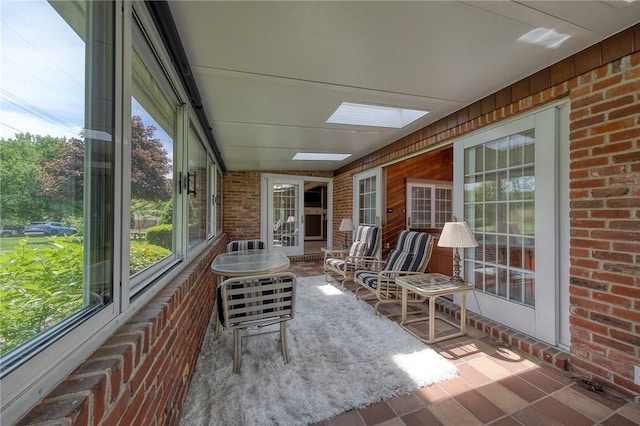 117 Glenfield Dr, Brighton Twp, PA 15009 - sunroom / solarium with brick wall, healthy amount of natural light, a skylight, and wood walls