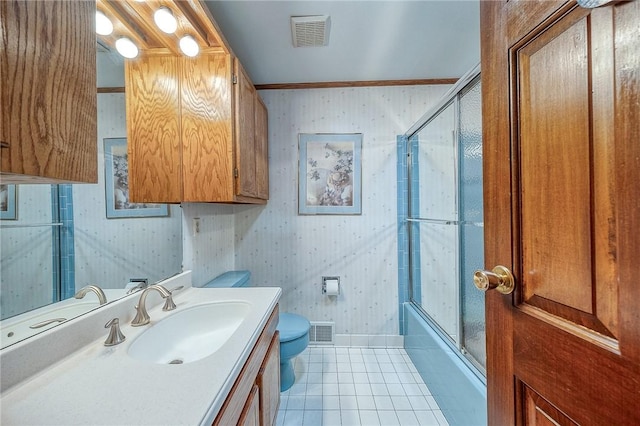 117 Glenfield Dr, Brighton Twp, PA 15009 - full bath featuring wallpapered walls, toilet, tile patterned flooring, vanity, and combined bath / shower with glass door