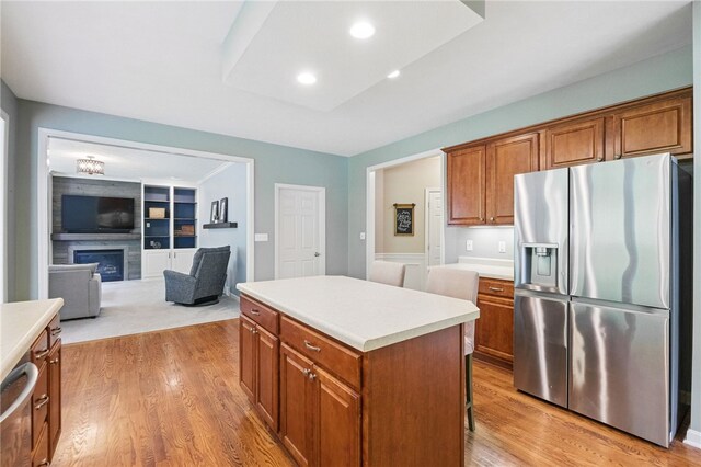 509 Rockport Pl, Marshall, PA 15090 - kitchen with stainless steel refrigerator with ice dispenser, brown cabinets, a center island, light wood-type flooring, and recessed lighting