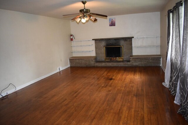 945 Brodhead Rd, Moon/Crescent Twp, PA 15108 - unfurnished living room featuring a ceiling fan, wood-type flooring, and a brick fireplace