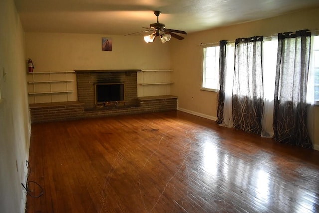 945 Brodhead Rd, Moon/Crescent Twp, PA 15108 - unfurnished living room featuring ceiling fan, wood finished floors, and a brick fireplace