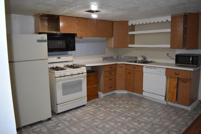 945 Brodhead Rd, Moon/Crescent Twp, PA 15108 - kitchen with white appliances, open shelves, light flooring, light countertops, and a textured ceiling