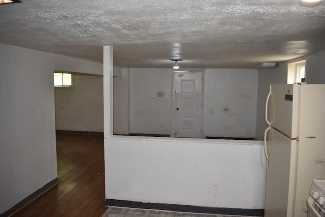 945 Brodhead Rd, Moon/Crescent Twp, PA 15108 - below grade area featuring freestanding refrigerator, wood finished floors, a textured ceiling, and healthy amount of natural light