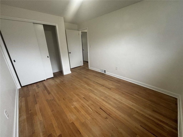 1123 Blue Jay Dr, Pittsburgh, PA 15243 - unfurnished bedroom with wood finished floors, baseboards, and a closet