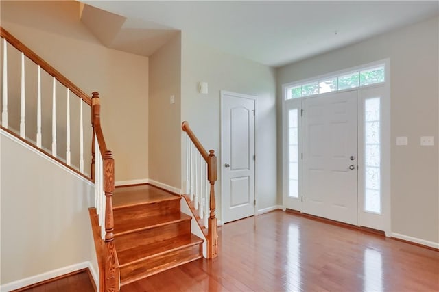 309 Trafalgar Sq, Cranberry Twp, PA 16066 - foyer entrance featuring wood finished floors, stairs, and baseboards