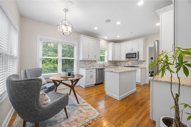 230 Summerlawn Dr, Bell Acres, PA 15143 - kitchen featuring appliances with stainless steel finishes, decorative backsplash, white cabinetry, light wood-style floors, and recessed lighting