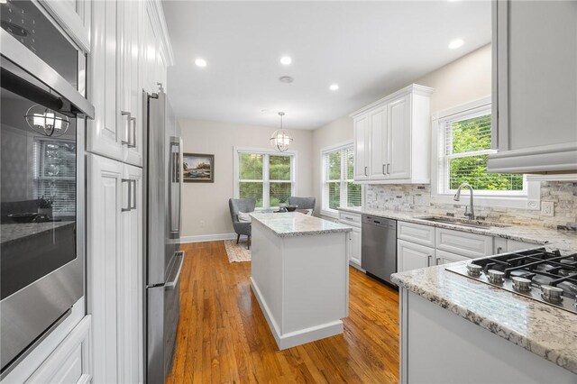 230 Summerlawn Dr, Bell Acres, PA 15143 - kitchen featuring stainless steel appliances, a sink, decorative backsplash, a chandelier, and recessed lighting