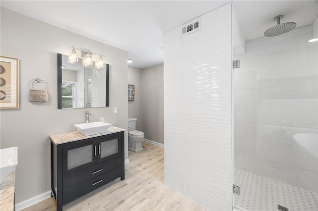 230 Summerlawn Dr, Bell Acres, PA 15143 - full bath with a shower stall, vanity, toilet, wood finished floors, and baseboards