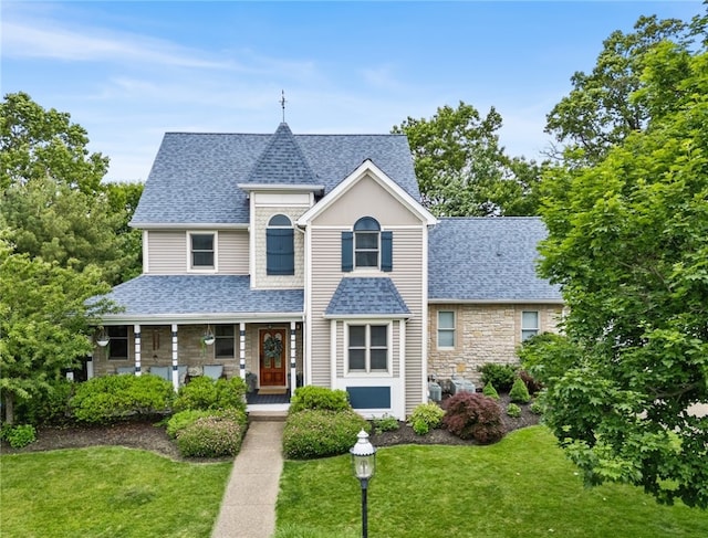 230 Summerlawn Dr, Bell Acres, PA 15143 - view of front of home featuring roof with shingles, a front lawn, stone siding, and covered porch