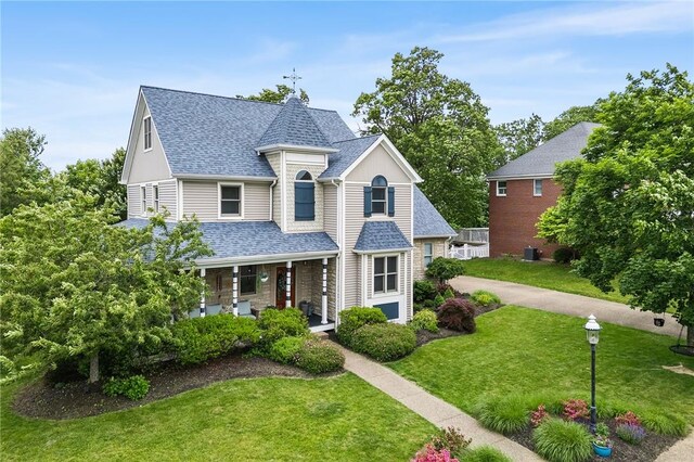 230 Summerlawn Dr, Bell Acres, PA 15143 - view of front of home with covered porch, a front lawn, and roof with shingles