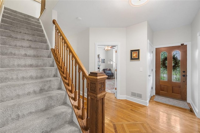 230 Summerlawn Dr, Bell Acres, PA 15143 - entryway with baseboards, stairway, light wood finished floors, and ceiling fan