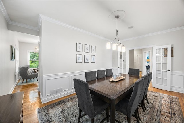 230 Summerlawn Dr, Bell Acres, PA 15143 - dining area featuring crown molding, light wood finished floors, french doors, and wainscoting