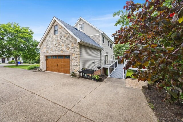 230 Summerlawn Dr, Bell Acres, PA 15143 - view of property exterior with stone siding, driveway, a garage, and a deck