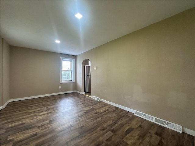 1081 Dixon Rd, Cherryhll Twp/Clymer, PA 15728 - spare room with arched walkways, dark wood-style floors, and baseboards