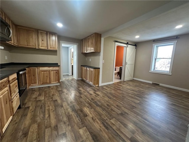 1081 Dixon Rd, Cherryhll Twp/Clymer, PA 15728 - kitchen featuring a barn door, stainless steel electric range, dark countertops, dark wood-style flooring, and baseboards