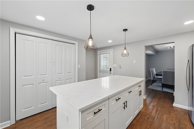 848 7th St, Verona, PA 15147 - kitchen with dark wood-style flooring, white cabinetry, recessed lighting, hanging light fixtures, and light stone counters