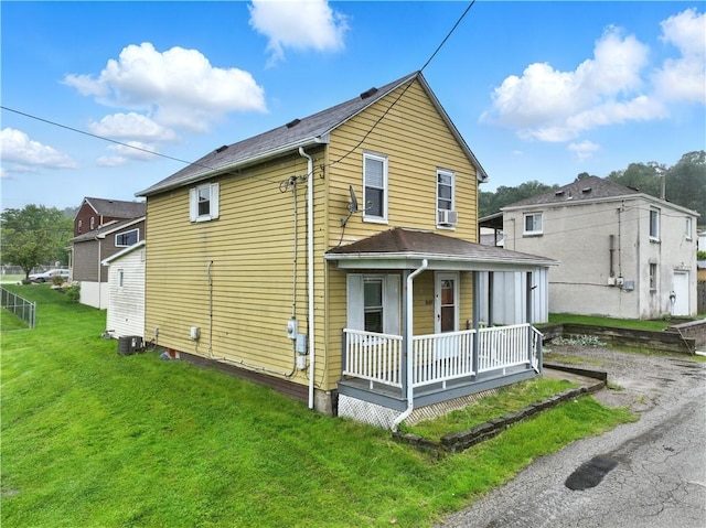 848 7th St, Verona, PA 15147 - back of house featuring covered porch, a lawn, and central AC unit