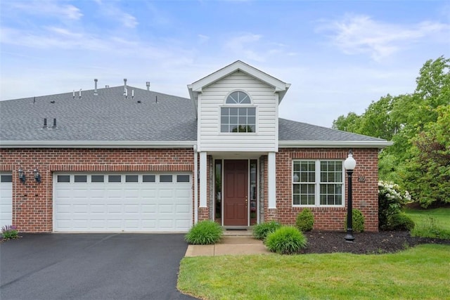 203 Providence Ct, Adams Twp, PA 16059 - traditional-style home with brick siding, asphalt driveway, and a garage