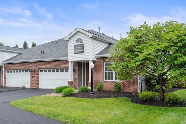203 Providence Ct, Adams Twp, PA 16059 - traditional home featuring brick siding, a shingled roof, a front yard, and an attached garage