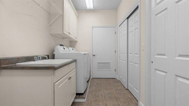 203 Providence Ct, Adams Twp, PA 16059 - laundry room featuring washing machine and clothes dryer, cabinet space, and light tile patterned flooring