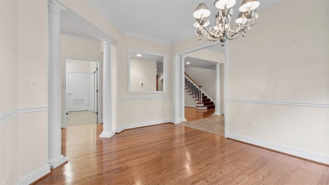 203 Providence Ct, Adams Twp, PA 16059 - unfurnished dining area featuring wood finished floors, ornamental molding, decorative columns, stairway, and baseboards