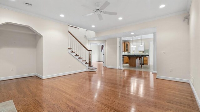 203 Providence Ct, Adams Twp, PA 16059 - unfurnished living room with a ceiling fan, crown molding, light wood finished floors, baseboards, and recessed lighting